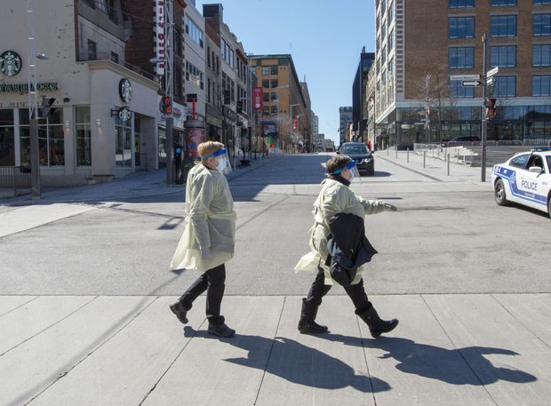 Health-care workers walk to work