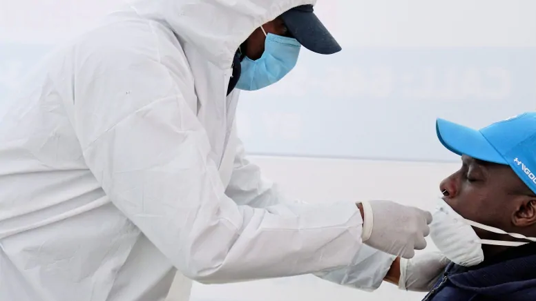 A patient gets a nasal swab test for the coronavirus