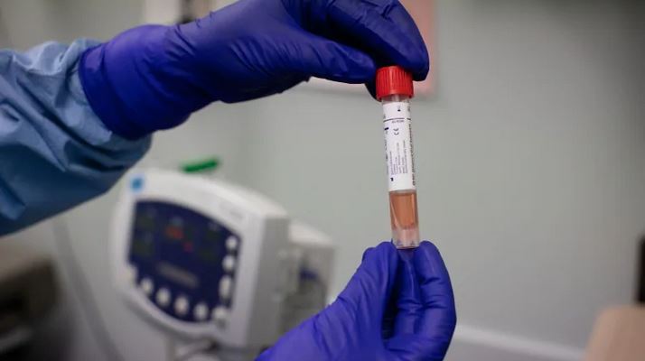 A COVID-19 swab test inside a vial