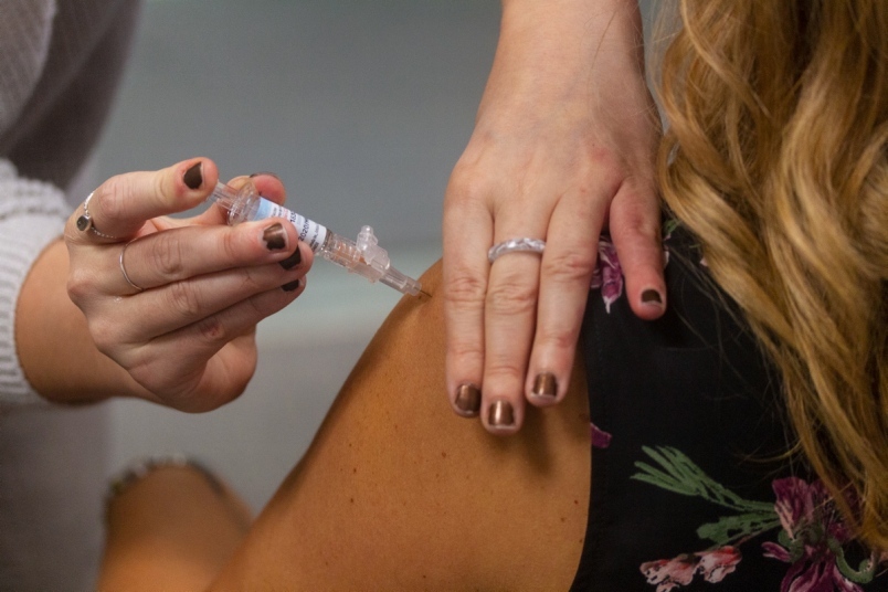 Person receiving a vaccine